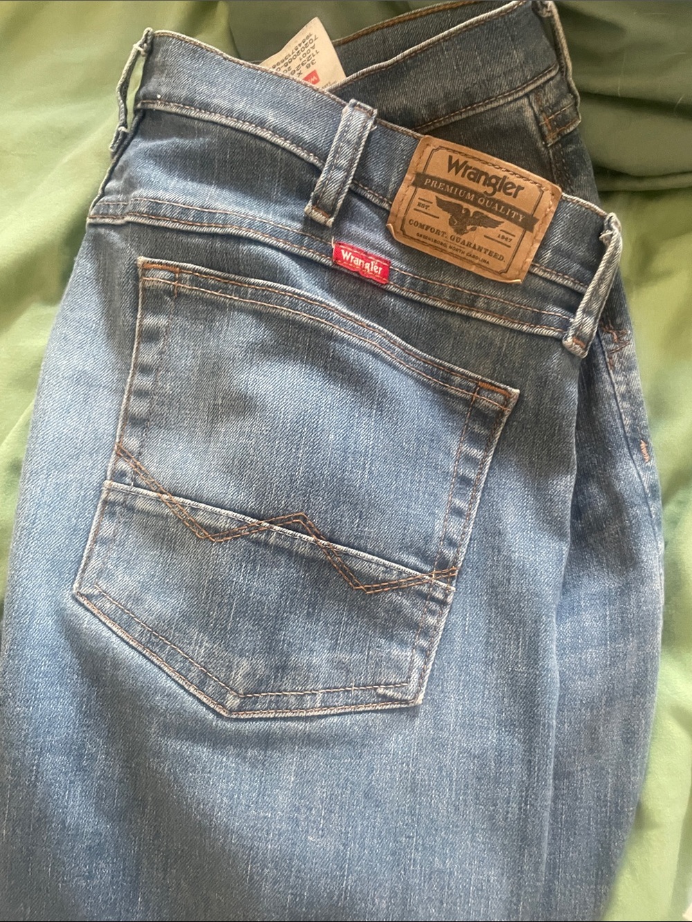 Wrangler Men's Light Blue Straight Leg Jeans with Tan Patch